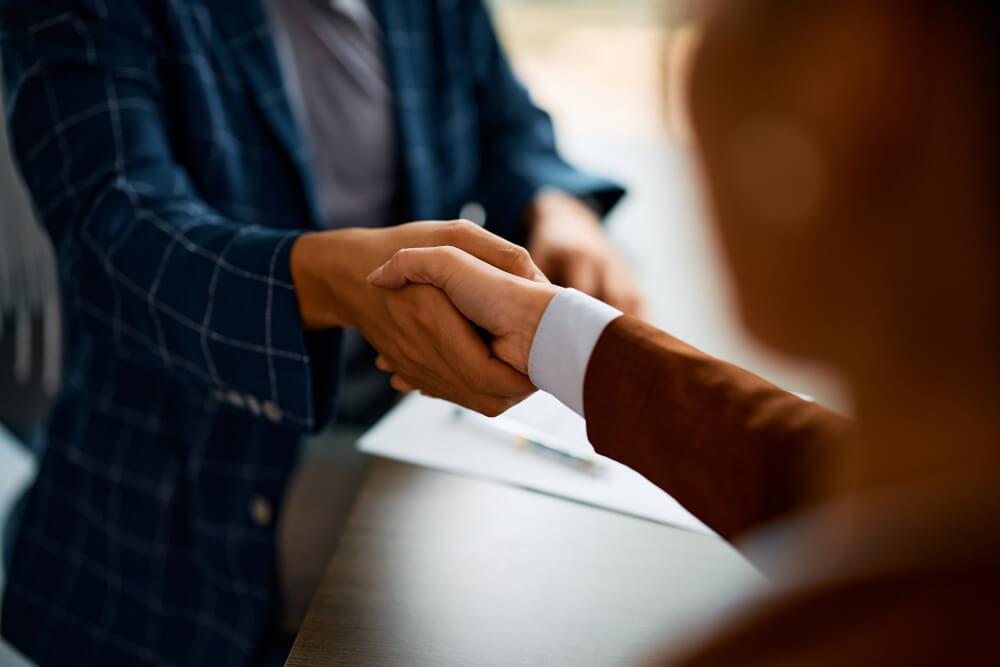 Two people shaking hands.